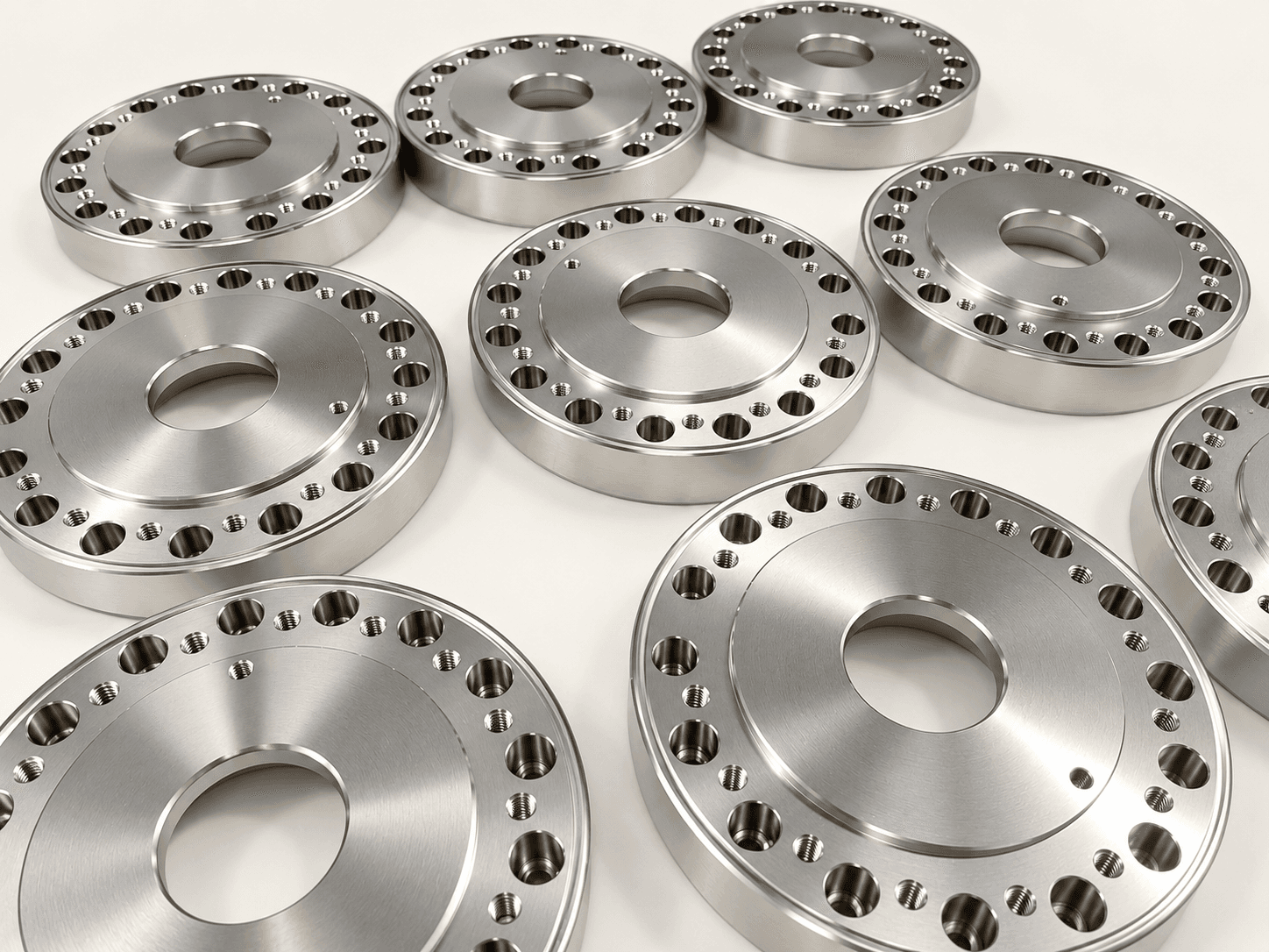 Batch of precision machined metal flange components